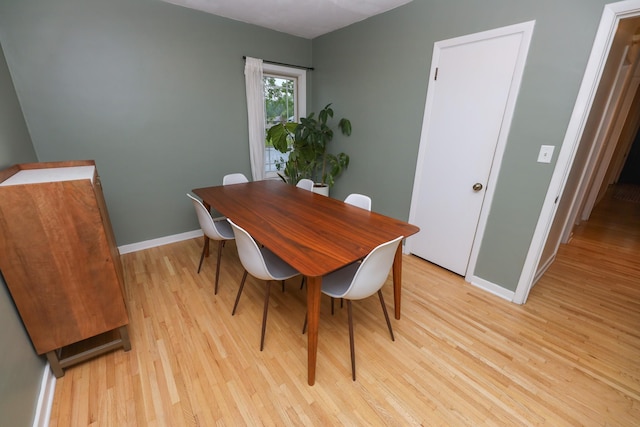 1423 Cedar St, Alexandria, MN 56308 - dining area featuring light wood-style flooring and baseboards