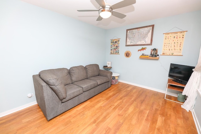 1423 Cedar St, Alexandria, MN 56308 - living room with wood finished floors, baseboards, and ceiling fan