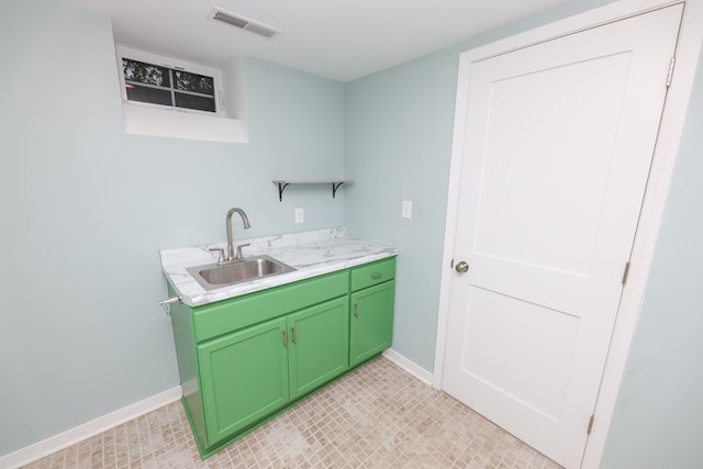 1423 Cedar St, Alexandria, MN 56308 - washroom with a sink, baseboards, and light tile patterned floors