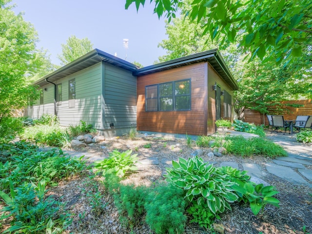 1423 Cedar St, Alexandria, MN 56308 - view of property exterior featuring a patio