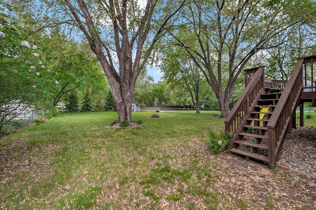 8474 Sunnyside Rd, Mounds View, MN 55112 - view of yard with stairway and a wooden deck