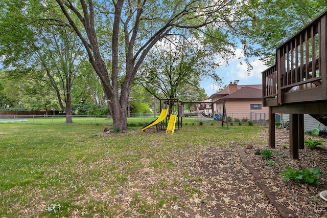 8474 Sunnyside Rd, Mounds View, MN 55112 - view of yard with a playground and a deck