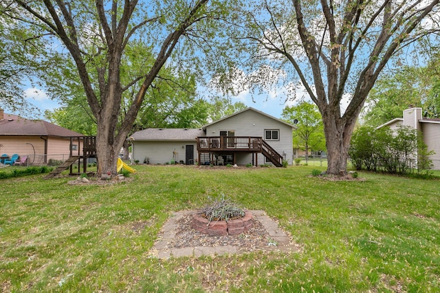8474 Sunnyside Rd, Mounds View, MN 55112 - back of property featuring stairway, a wooden deck, and a fire pit
