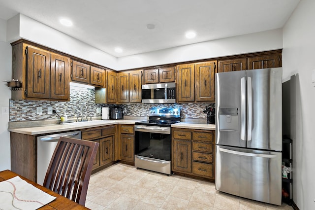 8474 Sunnyside Rd, Mounds View, MN 55112 - kitchen with appliances with stainless steel finishes, a sink, light countertops, and recessed lighting