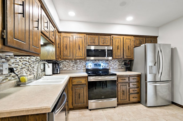8474 Sunnyside Rd, Mounds View, MN 55112 - kitchen with stainless steel appliances, a sink, light countertops, tasteful backsplash, and recessed lighting