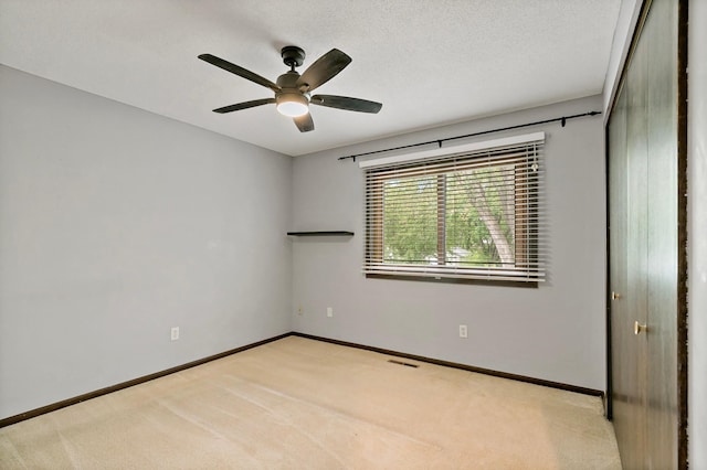 8474 Sunnyside Rd, Mounds View, MN 55112 - unfurnished room featuring light carpet, ceiling fan, and baseboards