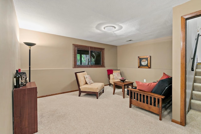 8474 Sunnyside Rd, Mounds View, MN 55112 - sitting room featuring carpet floors, stairs, and baseboards