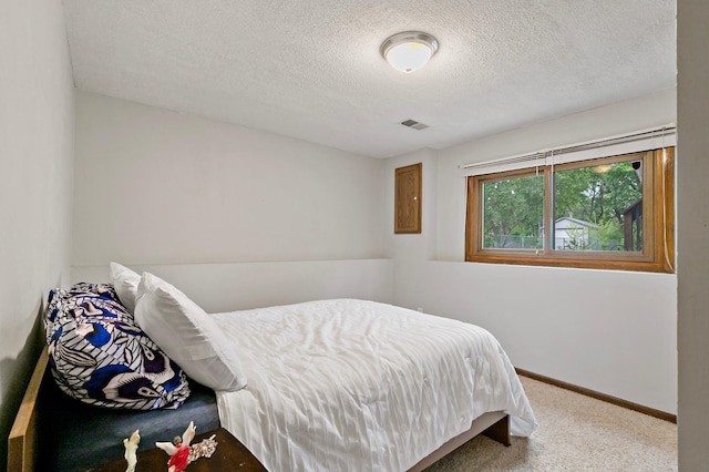 8474 Sunnyside Rd, Mounds View, MN 55112 - bedroom with a textured ceiling, carpet, and baseboards