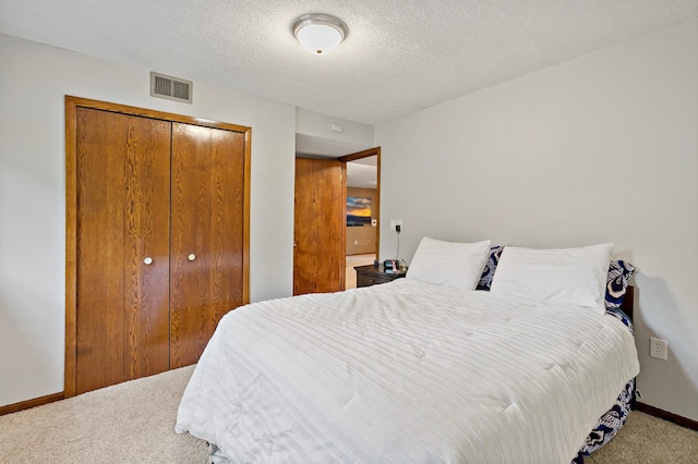 8474 Sunnyside Rd, Mounds View, MN 55112 - bedroom featuring carpet, a closet, baseboards, and a textured ceiling