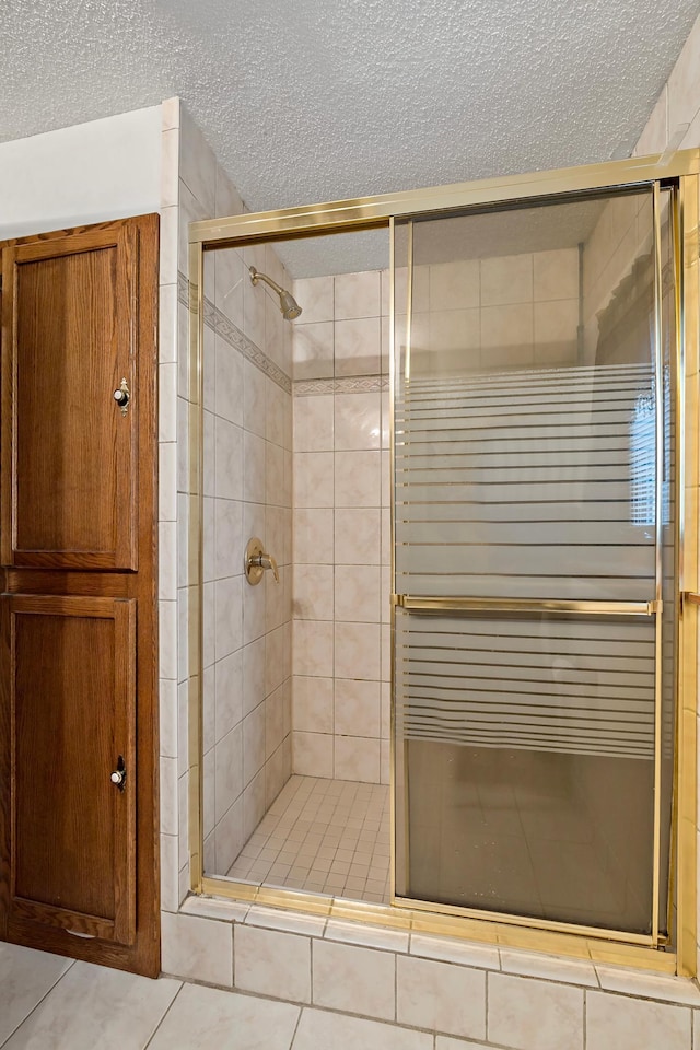 8474 Sunnyside Rd, Mounds View, MN 55112 - full bathroom with a textured ceiling, a stall shower, tile patterned floors, and radiator