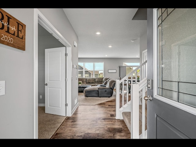 1750 Astoria Dr, Shakopee, MN 55379 - foyer featuring stairs, wood finished floors, baseboards, and recessed lighting