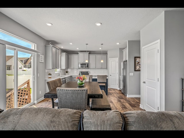 1750 Astoria Dr, Shakopee, MN 55379 - dining area with dark wood-type flooring, baseboards, and recessed lighting