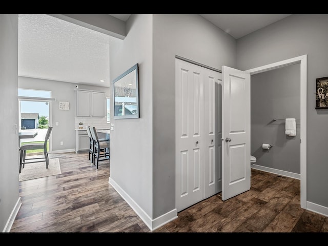 1750 Astoria Dr, Shakopee, MN 55379 - corridor featuring baseboards and dark wood finished floors