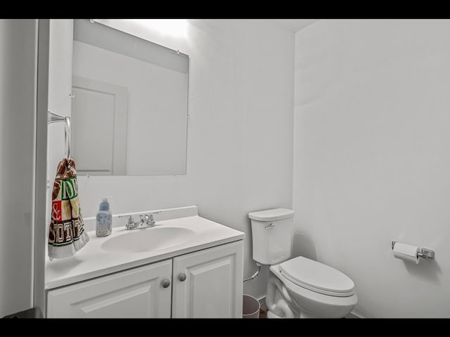 1750 Astoria Dr, Shakopee, MN 55379 - bathroom featuring toilet, vanity, and baseboards