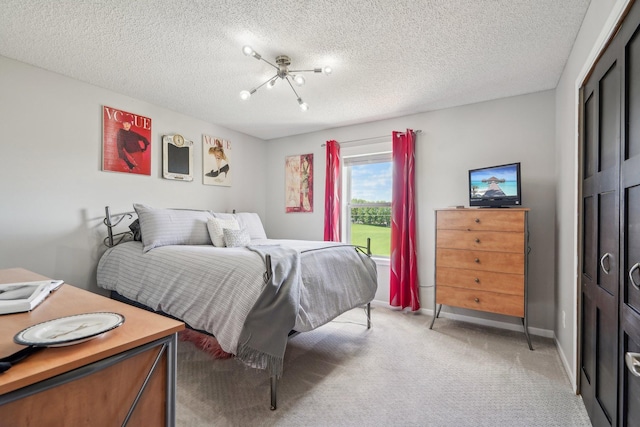 13543 Athena Way, Rosemount, MN 55068 - bedroom featuring light colored carpet, a closet, a textured ceiling, and baseboards