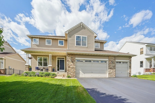13543 Athena Way, Rosemount, MN 55068 - view of front of home featuring asphalt driveway, a porch, stone siding, and an attached garage