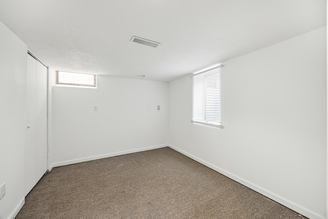 6407 Emerson Ave N, Brooklyn Center, MN 55430 - below grade area featuring carpet floors and baseboards