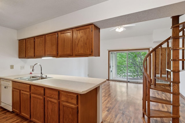 1225 Ferndale St N Unit B16, Maplewood, MN 55119 - kitchen with a sink, white dishwasher, wood finished floors, ceiling fan, and brown cabinets