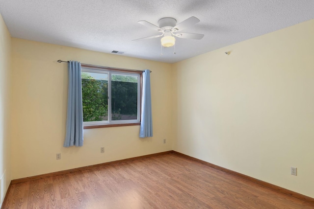 1225 Ferndale St N Unit B16, Maplewood, MN 55119 - spare room featuring wood finished floors, ceiling fan, a textured ceiling, and baseboards
