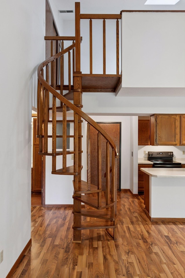 1225 Ferndale St N Unit B16, Maplewood, MN 55119 - staircase with wood finished floors and baseboards