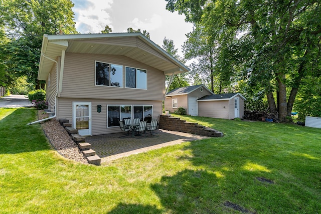 13914 Elmer Hanson Dr SE, Woodside Twp, MN 56736 - rear view of house featuring a lawn and a patio