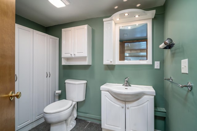 13914 Elmer Hanson Dr SE, Woodside Twp, MN 56736 - bathroom featuring toilet, vanity, tile patterned floors, baseboards, and recessed lighting