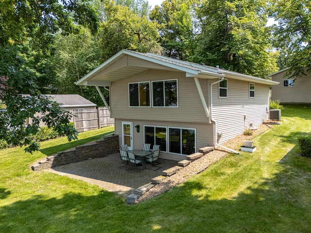 13914 Elmer Hanson Dr SE, Woodside Twp, MN 56736 - back of property featuring cooling unit and a patio