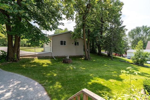13914 Elmer Hanson Dr SE, Woodside Twp, MN 56736 - view of grassy yard featuring a deck