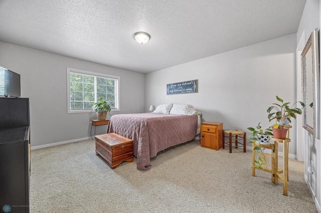 5512 Bishops Blvd S Unit D, Fargo, ND 58104 - carpeted bedroom with a textured ceiling and baseboards