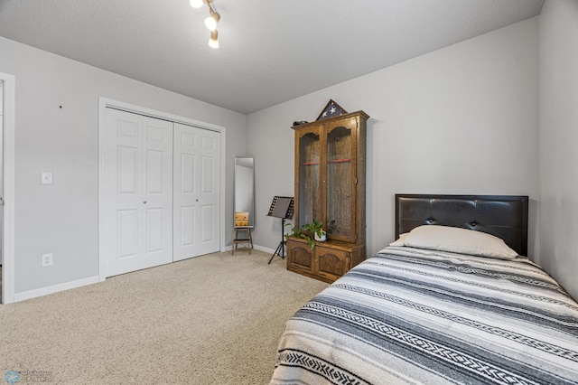 5512 Bishops Blvd S Unit D, Fargo, ND 58104 - carpeted bedroom featuring a closet and baseboards