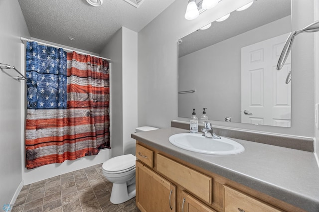 5512 Bishops Blvd S Unit D, Fargo, ND 58104 - bathroom featuring vanity, toilet, shower / bathtub combination with curtain, a textured ceiling, and stone finish floors