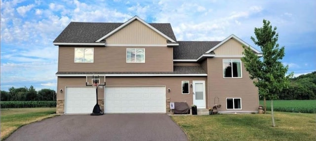 613 Farmers Pl, Belle Plaine, MN 56011 - view of front of property featuring asphalt driveway, an attached garage, a front lawn, and a shingled roof