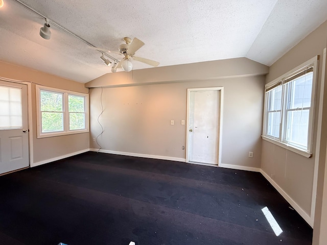 938 Selby Ave, Saint Paul Park, MN 55071 - empty room featuring lofted ceiling, baseboards, a textured ceiling, and ceiling fan