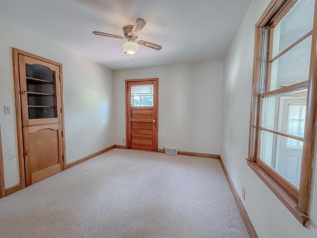 938 Selby Ave, Saint Paul Park, MN 55071 - empty room featuring light carpet, baseboards, and a ceiling fan