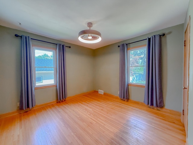 938 Selby Ave, Saint Paul Park, MN 55071 - empty room with light wood-style flooring and baseboards