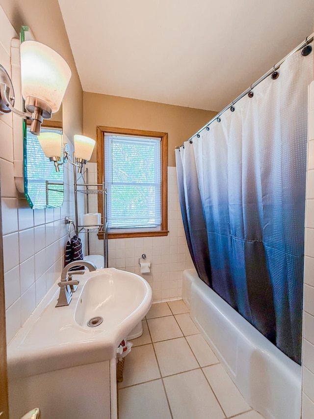 938 Selby Ave, Saint Paul Park, MN 55071 - full bathroom featuring tile walls, tile patterned flooring, shower / bath combo with shower curtain, and vanity