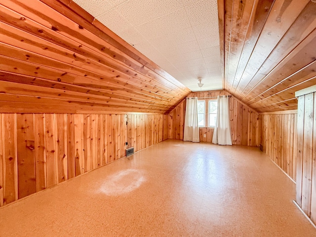 938 Selby Ave, Saint Paul Park, MN 55071 - additional living space with tile patterned floors, wood walls, and lofted ceiling
