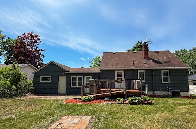 938 Selby Ave, Saint Paul Park, MN 55071 - rear view of property featuring a chimney, a deck, a lawn, and cooling unit