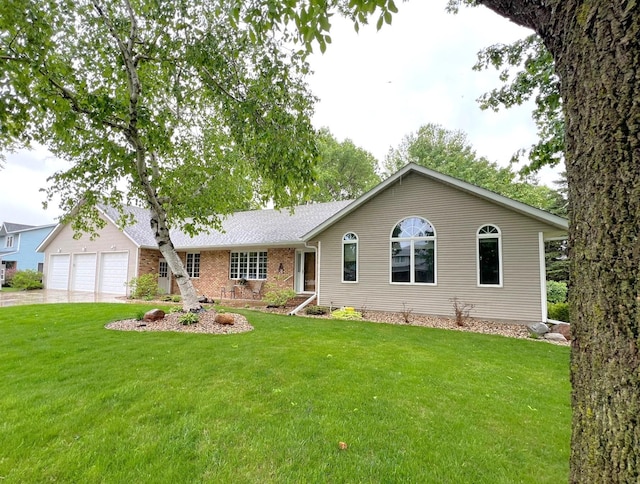 1715 Hansen Dr SW, Willmar, MN 56201 - single story home with a garage, a front lawn, driveway, and brick siding