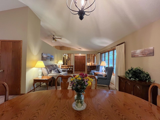 1715 Hansen Dr SW, Willmar, MN 56201 - dining space featuring lofted ceiling, a ceiling fan, and a chandelier
