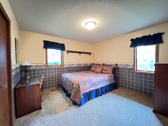1715 Hansen Dr SW, Willmar, MN 56201 - carpeted bedroom with wainscoting and a textured ceiling