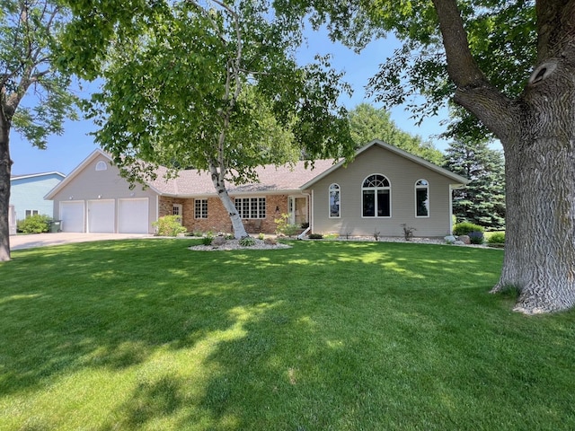 1715 Hansen Dr SW, Willmar, MN 56201 - single story home featuring a front lawn, an attached garage, driveway, and brick siding