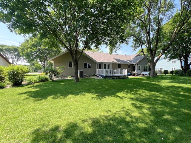 1715 Hansen Dr SW, Willmar, MN 56201 - rear view of house featuring a wooden deck and a yard
