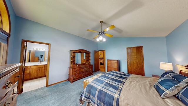 1715 Hansen Dr SW, Willmar, MN 56201 - bedroom featuring vaulted ceiling, light colored carpet, a ceiling fan, and ensuite bathroom