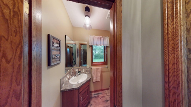 1715 Hansen Dr SW, Willmar, MN 56201 - bathroom featuring vanity and wood finished floors