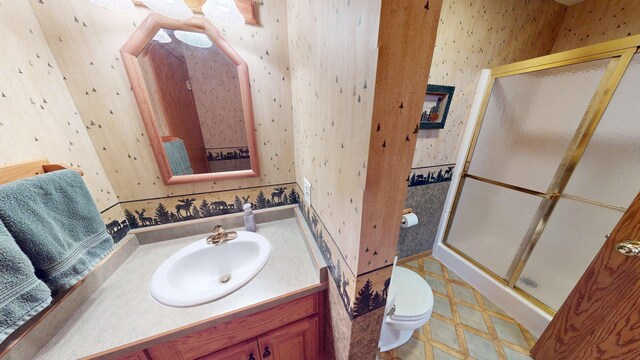 1715 Hansen Dr SW, Willmar, MN 56201 - full bathroom with wallpapered walls, a stall shower, vanity, and tile patterned floors