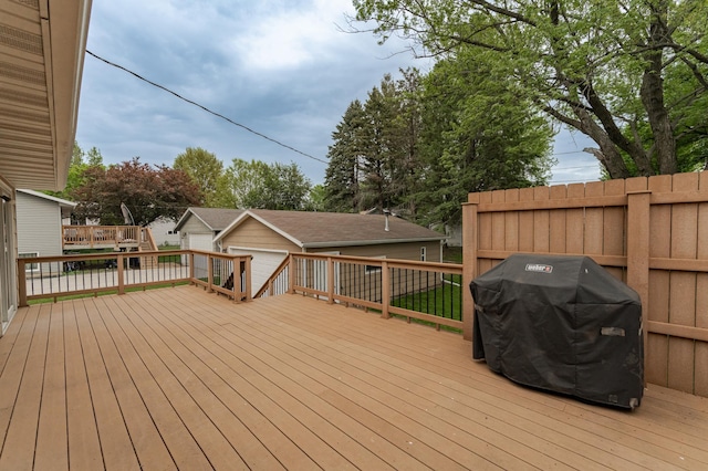 222 6th Ave NW, Byron, MN 55920 - wooden deck with grilling area and an outdoor structure
