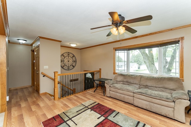 222 6th Ave NW, Byron, MN 55920 - living room with wood finished floors, crown molding, a ceiling fan, and baseboards