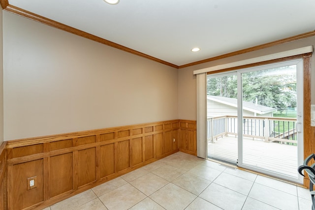 222 6th Ave NW, Byron, MN 55920 - empty room featuring a wainscoted wall, crown molding, light tile patterned floors, and recessed lighting