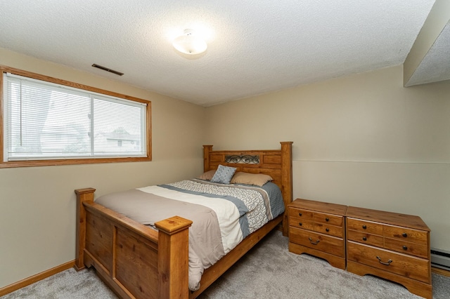 222 6th Ave NW, Byron, MN 55920 - bedroom featuring light colored carpet, a textured ceiling, and baseboards